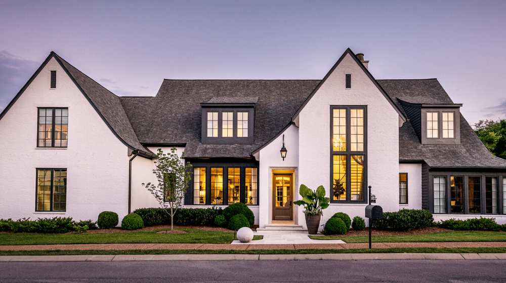 Beautiful custom built modern home exterior with elegant lighting
